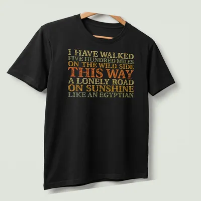 Vintage distressed shirt featuring humorous text about walking like an Egyptian. — printed on a unisex t-shirt (angled view)