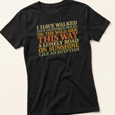 Vintage distressed shirt featuring humorous text about walking like an Egyptian. — printed on a women's shirt