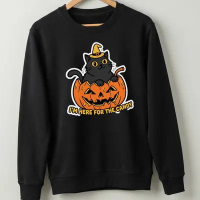 Kawaii style black cat in pumpkin with candy-themed text — printed on a unisex sweatshirt