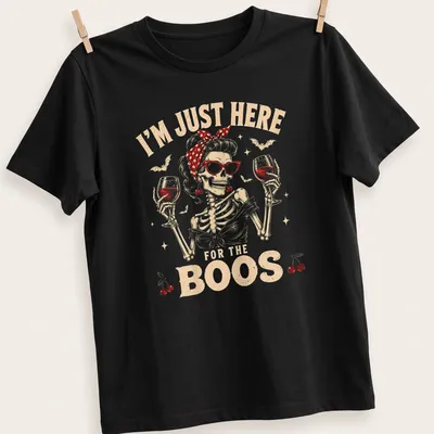 Vintage retro t-shirt featuring a skeleton holding wine glasses with Halloween-themed text