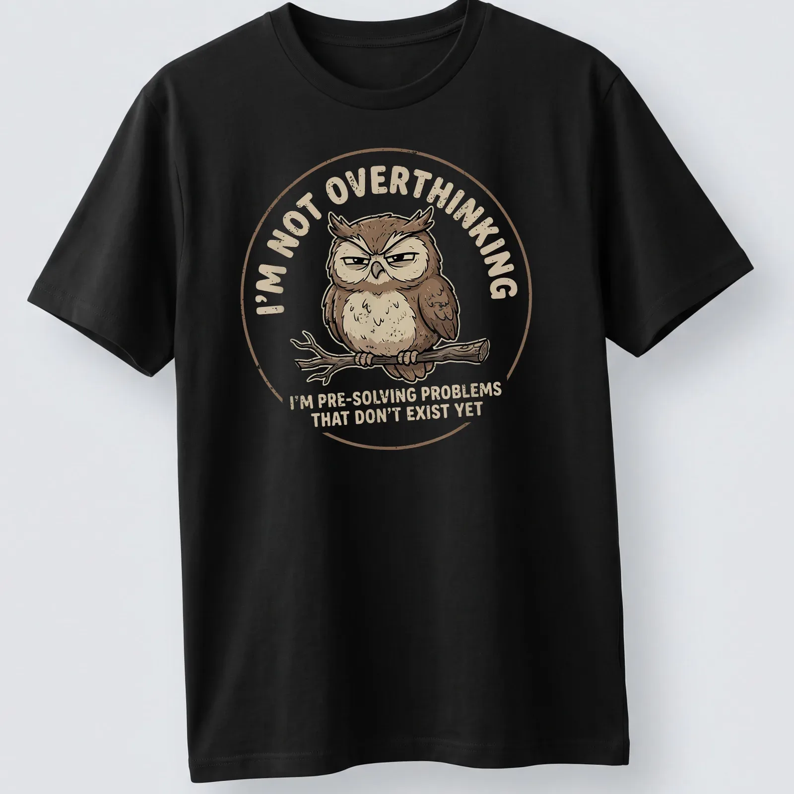 Cartoon owl design with humorous text about overthinking problems — printed on a unisex t-shirt