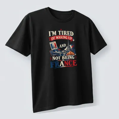 Vintage retro Paris design with text about waking up in France — printed on a unisex t-shirt (angled view)