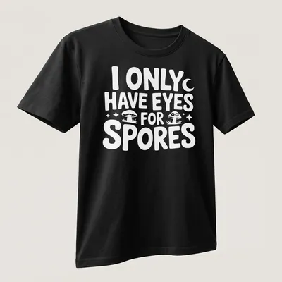 Playful illustration of mushrooms with the text I Only Have Eyes For Spores — printed on a unisex t-shirt (angled view)