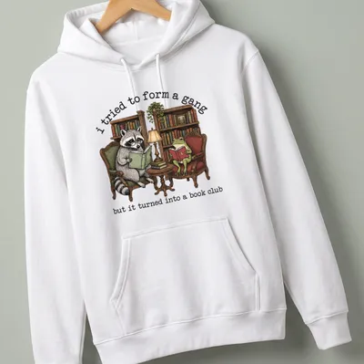 Vintage illustration of a raccoon and frog reading books with humorous text — printed on a unisex hoodie