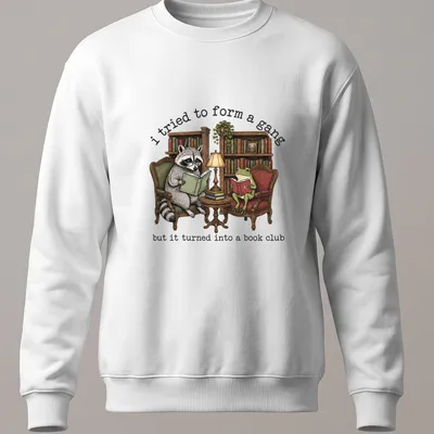 Vintage illustration of a raccoon and frog reading books with humorous text — printed on a unisex sweatshirt