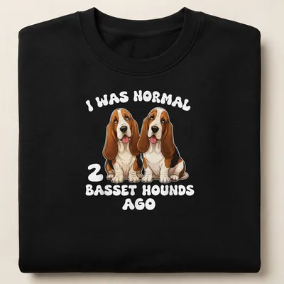 Cartoon style t-shirt featuring humorous text and two Basset Hounds — printed on a unisex sweatshirt