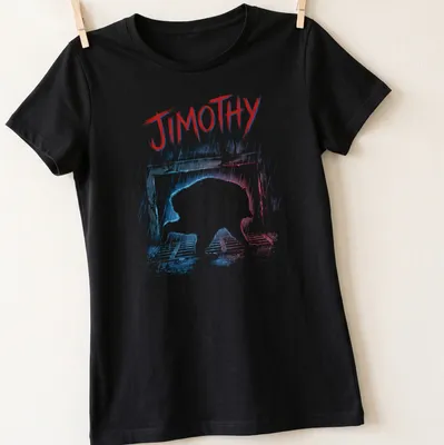 Grunge style print of a raccoon named Jimothy crawling out of a storm drain — printed on a women's shirt