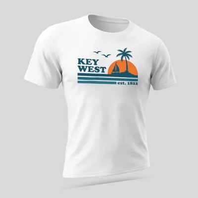Vintage retro Key West T-shirt with sailboat and palm tree graphic — printed on a unisex t-shirt (angled view)
