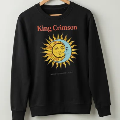 Vintage T-shirt featuring King Crimson artwork with sun and moon faces in bold colors. — printed on a unisex sweatshirt