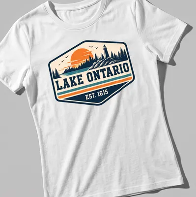 Vintage Lake Ontario T-shirt with a lighthouse and sunset illustration — printed on a women's shirt
