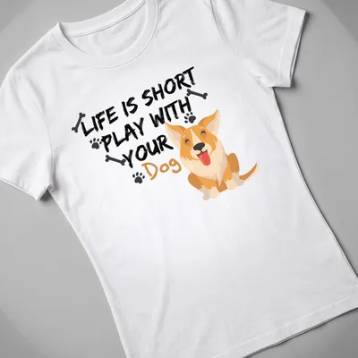 Cute cartoon Corgi with the phrase 'Life Is Short Play With Your Dog' printed above — printed on a women's shirt