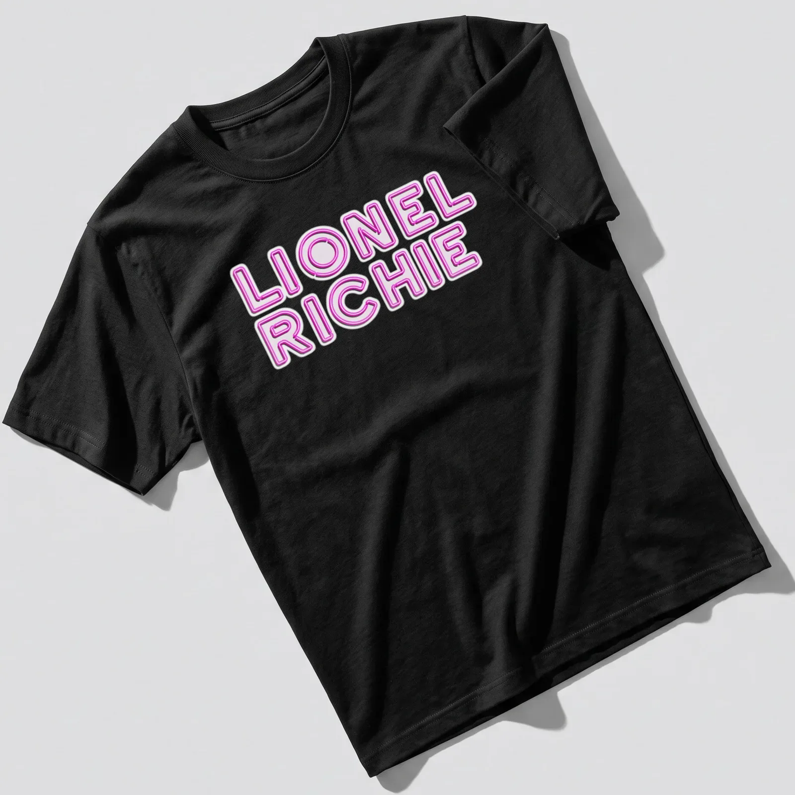 Neon pink and white printed Lionel Richie logo — printed on a unisex t-shirt