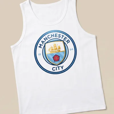 Manchester City crest t-shirt with emblem design in blue, gold, red, and white — printed on a tank top