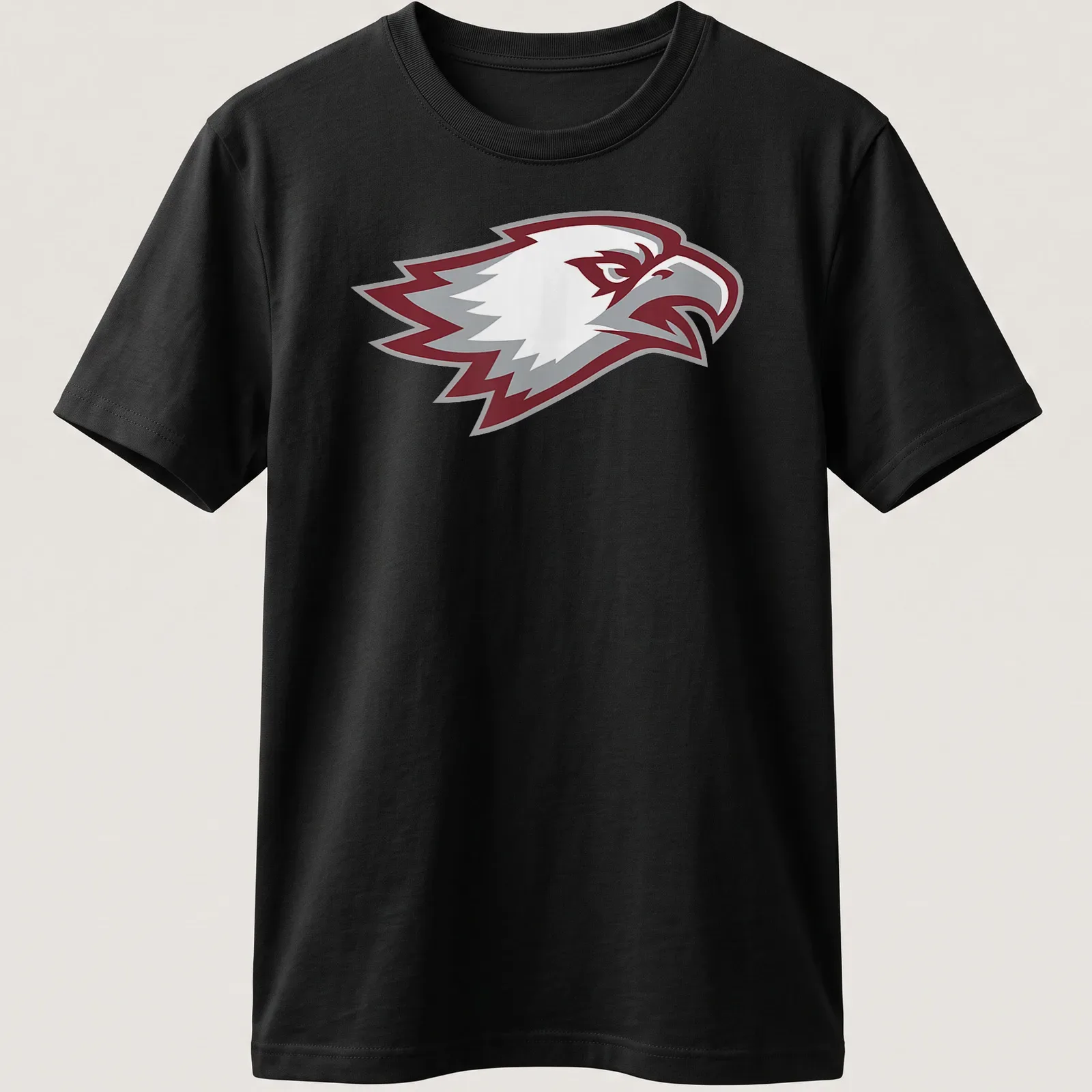 Bold graphic of an eagle head in maroon, gray, and white for Marjory Stoneman Douglas Eagles — printed on a unisex t-shirt