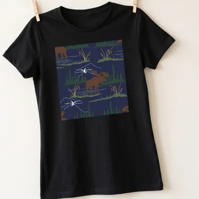Illustration of a moose in a nature pattern with navy blue background — printed on a women's shirt