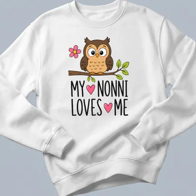 Kawaii cartoon owl design with text 'MY ♥ NONNI LOVES ♥ ME' in colorful lettering — printed on a unisex sweatshirt