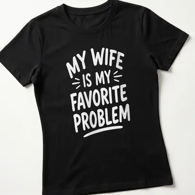 White text graphic reading 'My Wife Is My Favorite Problem' on — printed on a women's shirt
