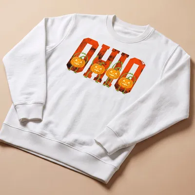 Vintage Halloween tee with pumpkins and 'O H I O' text in orange and black — printed on a unisex sweatshirt