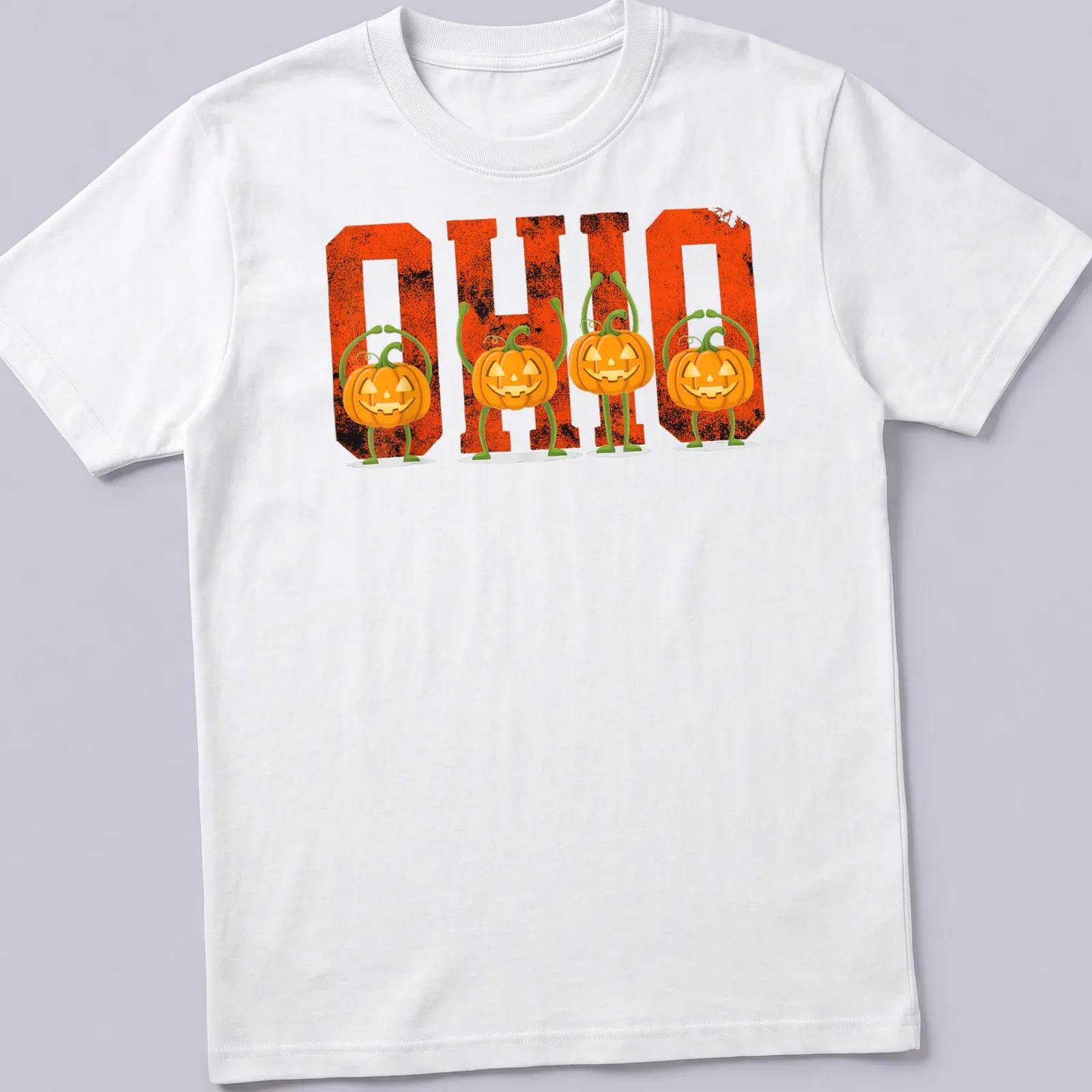 Vintage Halloween tee with pumpkins and 'O H I O' text in orange and black — printed on a unisex t-shirt