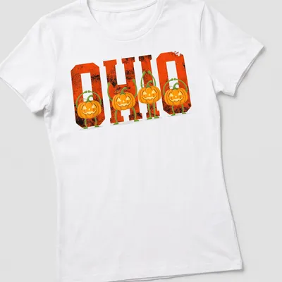 Vintage Halloween tee with pumpkins and 'O H I O' text in orange and black — printed on a women's shirt