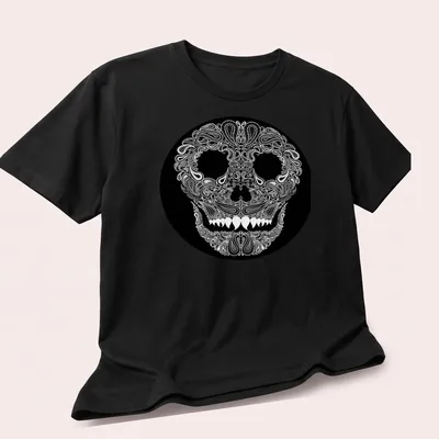 Skull design with paisley pattern in white on a black background — printed on a unisex t-shirt (angled view)