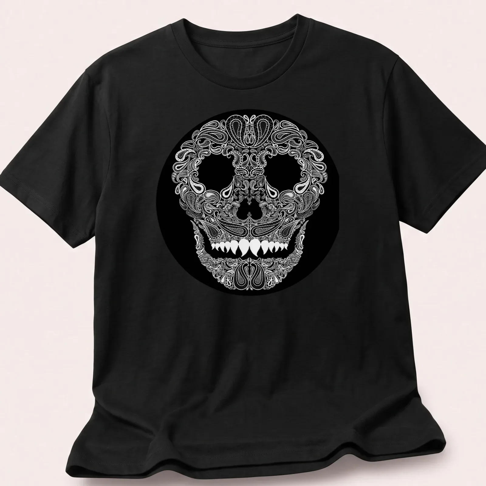 Skull design with paisley pattern in white on a black background — printed on a unisex t-shirt