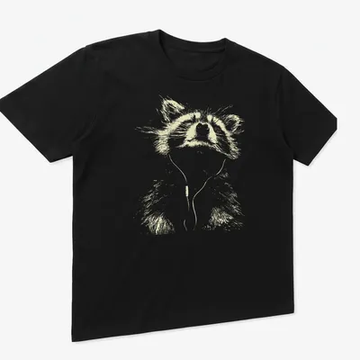 Minimalist line-art of a peaceful raccoon listening to music in light beige and white — printed on a unisex t-shirt (angled view)