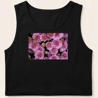 Photographic floral design featuring pink chrysanthemums with green leaves — printed on a tank top