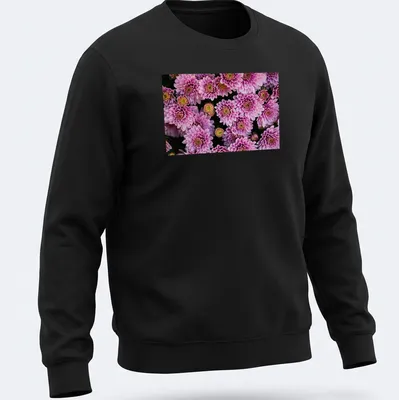 Photographic floral design featuring pink chrysanthemums with green leaves — printed on a unisex sweatshirt