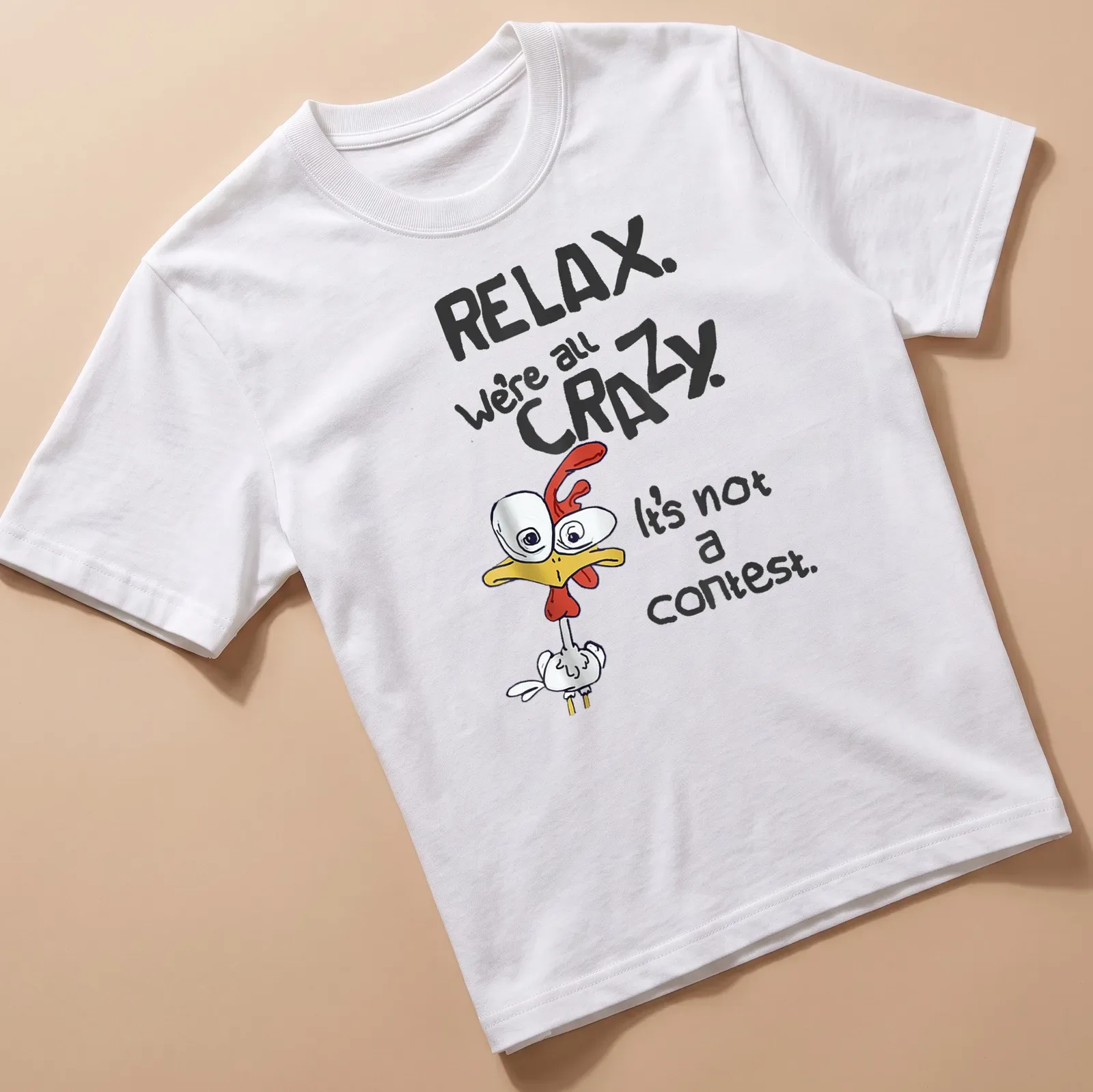 Playful cartoon chicken graphic with humorous text about craziness. — printed on a unisex t-shirt