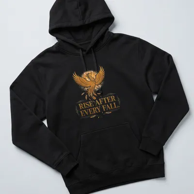 Detailed illustration of a phoenix with the text 'Rise After Every Fall' in gold and orange — printed on a unisex hoodie