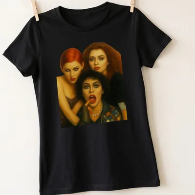 Realistic portrait of three characters from Rocky Horror Picture Show in red, black, brown, and skin tones. — printed on a women's shirt