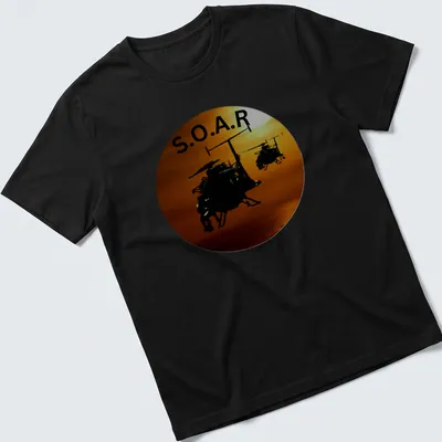 Silhouette of helicopters flying in a sunset with the text S.O.A.R.