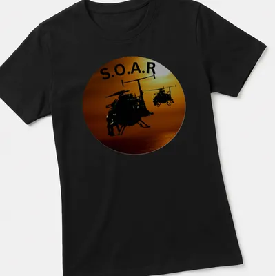 Silhouette of helicopters flying in a sunset with the text S.O.A.R. — printed on a women's shirt