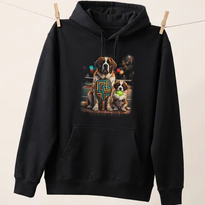 Realistic illustration of two Saint Bernard puppies holding pickleball paddles in brown and white — printed on a unisex hoodie