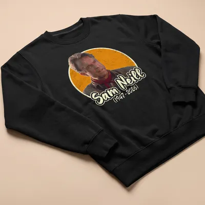 Vintage distressed tribute t-shirt honoring Sam Neill with printed text — printed on a unisex sweatshirt