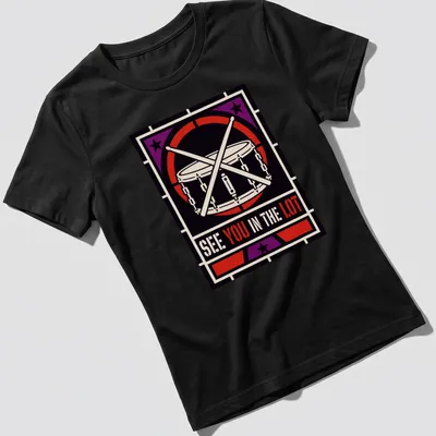 Bold geometric design featuring a drum and drumsticks with text — printed on a women's shirt