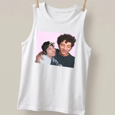 Playful illustration of two friends embracing on a colorful gaming-themed — printed on a tank top