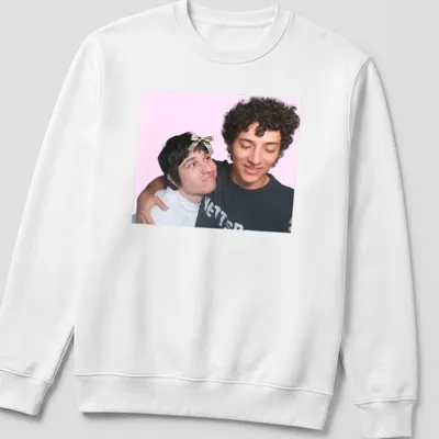 Playful illustration of two friends embracing on a colorful gaming-themed — printed on a unisex sweatshirt
