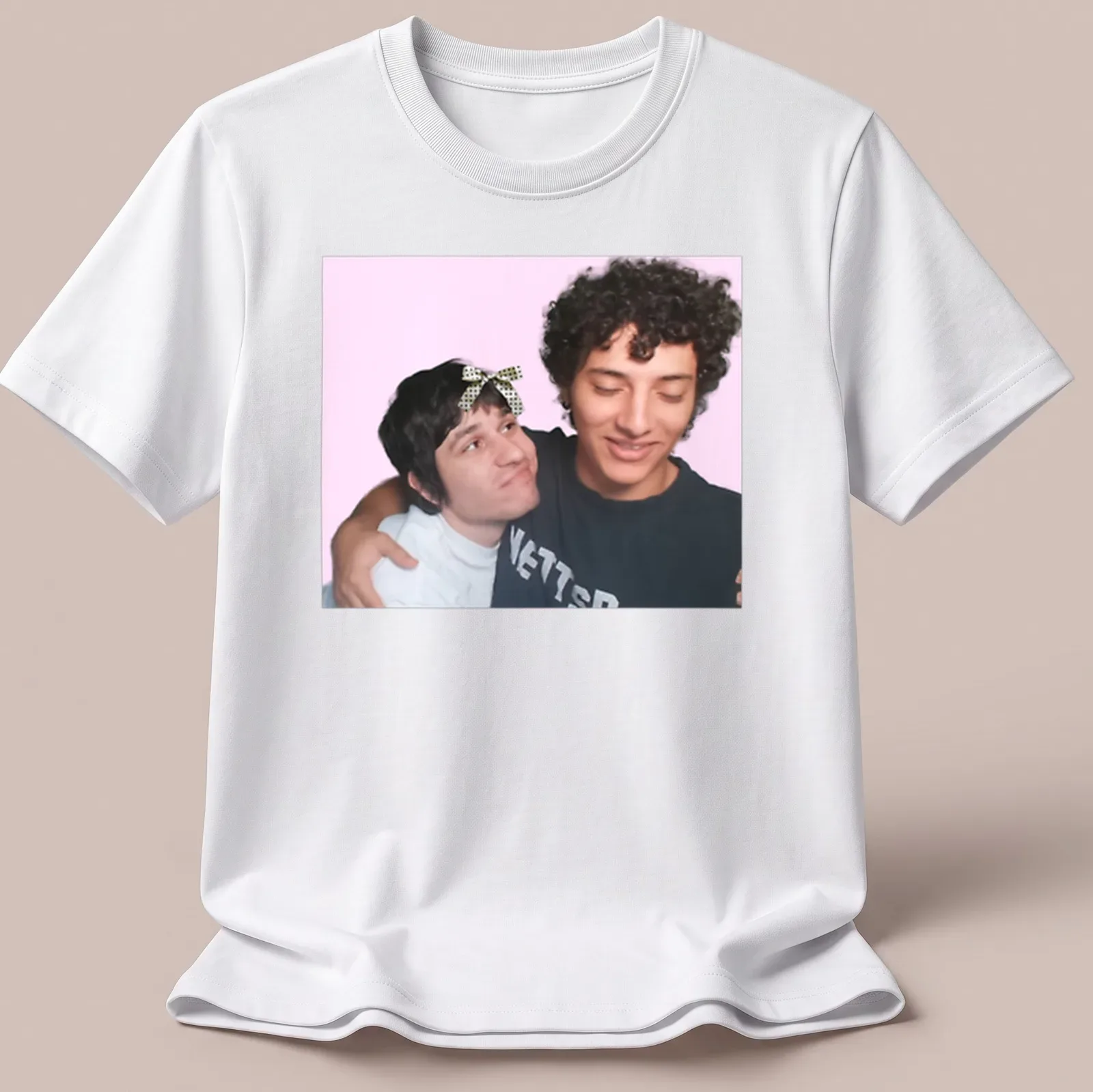Playful illustration of two friends embracing on a colorful gaming-themed — printed on a unisex t-shirt