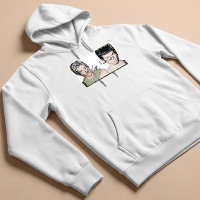Photographic design depicting two young men with unique hairstyles and the text 'Slushy Nooobz'. — printed on a unisex hoodie