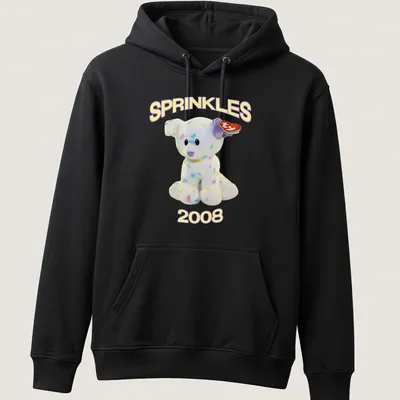 Cute cartoon plush dog with pastel colors and 'SPRINKLES 2008' text — printed on a unisex hoodie