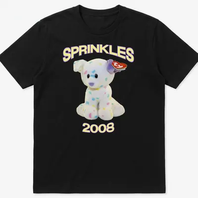 Cute cartoon plush dog with pastel colors and 'SPRINKLES 2008' text
