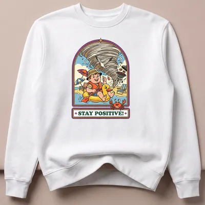 Vintage cartoon t-shirt showing a child in a duck float during a tornado with the text Stay Positive! — printed on a unisex sweatshirt