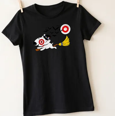 Cartoon of a dog on a broomstick in a witch's hat for Halloween — printed on a women's shirt