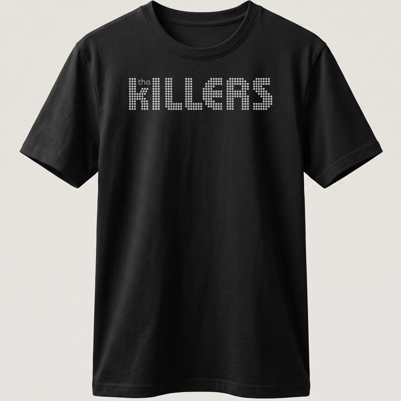White t-shirt featuring the KILLERS band name in dotted typography — printed on a unisex t-shirt