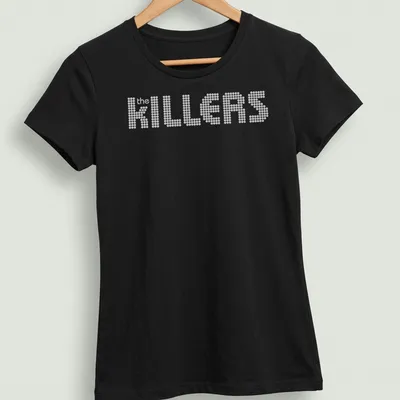 White t-shirt featuring the KILLERS band name in dotted typography — printed on a women's shirt