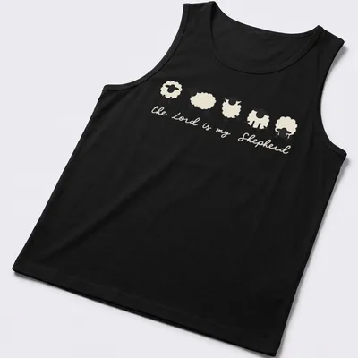 Minimalist sheep illustration with the text 'the Lord is my Shepherd' in cream and black. — printed on a tank top