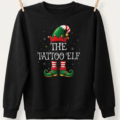 Colorful cartoon of a Christmas elf with tattoos and festive attire — printed on a unisex sweatshirt