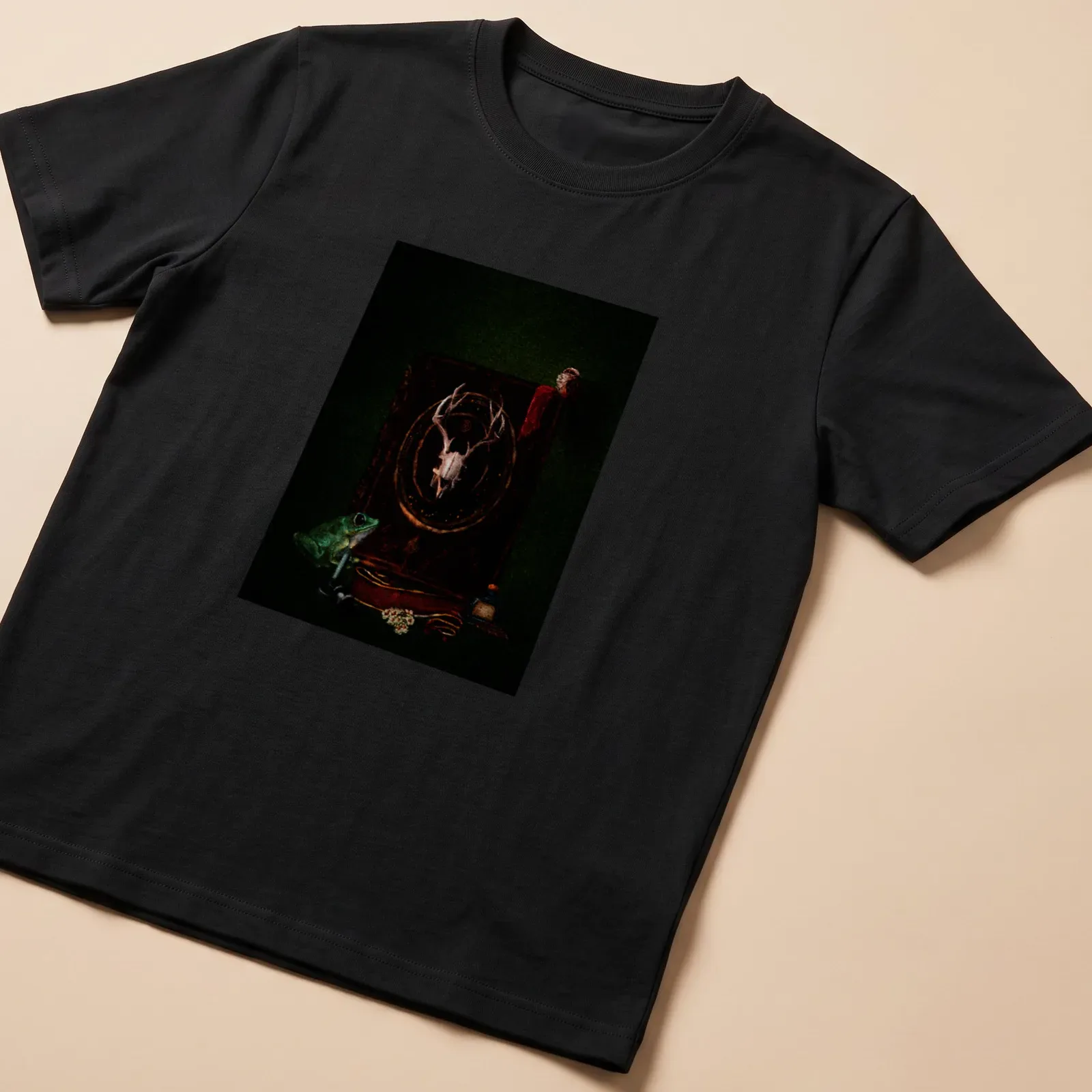 Dark Academia T-shirt with a frog, skull, and gothic book illustration — printed on a unisex t-shirt
